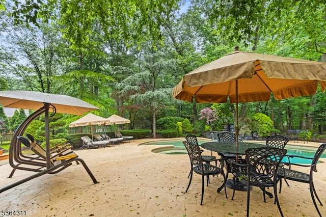 2242 Shawnee Path, Scotch Plains Twp, NJ 07076 - view of patio featuring an in-ground hot tub, an outdoor pool, view of scattered trees, and outdoor dining area