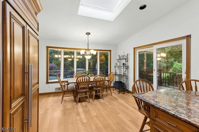 2242 Shawnee Path, Scotch Plains Twp, NJ 07076 - dining space with a chandelier, light wood finished floors, lofted ceiling, and a skylight