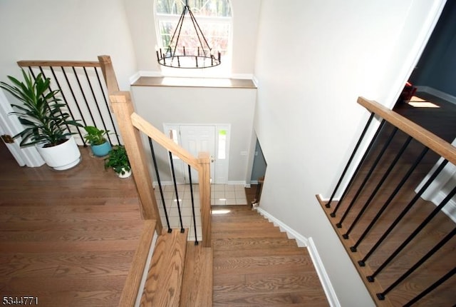 58 Greenbrook Rd, Green Brook Twp, NJ 08812 - stairway with wood finished floors and a chandelier