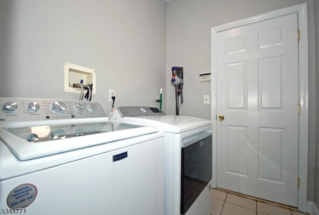 58 Greenbrook Rd, Green Brook Twp, NJ 08812 - laundry area with independent washer and dryer and light tile patterned flooring