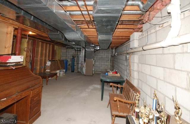 58 Greenbrook Rd, Green Brook Twp, NJ 08812 - unfinished below grade area featuring heating unit, a water softener, and concrete block wall