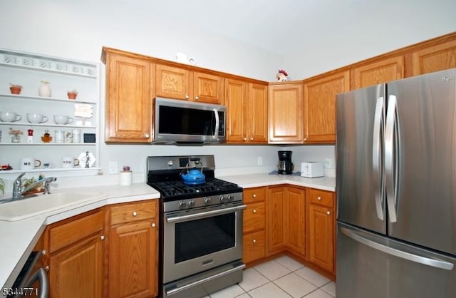58 Greenbrook Rd, Green Brook Twp, NJ 08812 - kitchen featuring appliances with stainless steel finishes, light countertops, light tile patterned flooring, and brown cabinetry