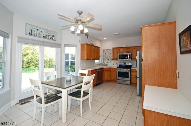 58 Greenbrook Rd, Green Brook Twp, NJ 08812 - dining area with light tile patterned floors and ceiling fan