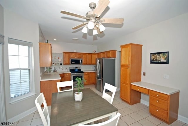 58 Greenbrook Rd, Green Brook Twp, NJ 08812 - dining room with ceiling fan, built in study area, and light tile patterned floors