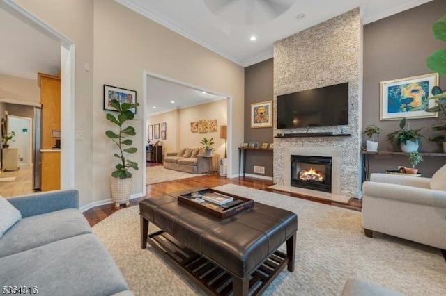 7 Whalen Ct, West Orange Twp, NJ 07052 - living room featuring ceiling fan, ornamental molding, a large fireplace, recessed lighting, and wood finished floors