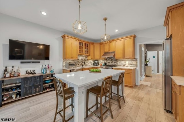 7 Whalen Ct, West Orange Twp, NJ 07052 - kitchen featuring light wood-style floors, light countertops, appliances with stainless steel finishes, and recessed lighting