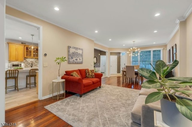 7 Whalen Ct, West Orange Twp, NJ 07052 - living room with a chandelier, ornamental molding, wood finished floors, and recessed lighting