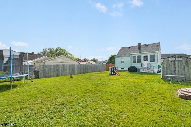 520 Marion St, Bound Brook Boro, NJ 08805 - fenced backyard with a trampoline and a shed