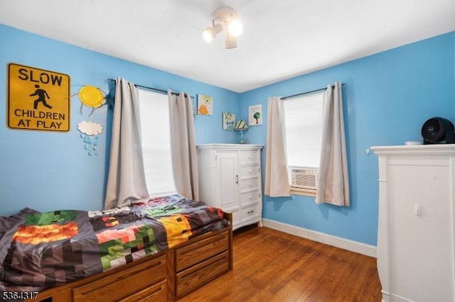 520 Marion St, Bound Brook Boro, NJ 08805 - bedroom with wood finished floors, ceiling fan, and cooling unit