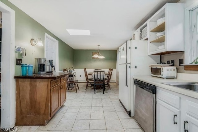 53 Lonaconing Rd, Vernon Twp, NJ 07422 - kitchen with stainless steel dishwasher, light tile patterned flooring, open shelves, a skylight, and decorative light fixtures