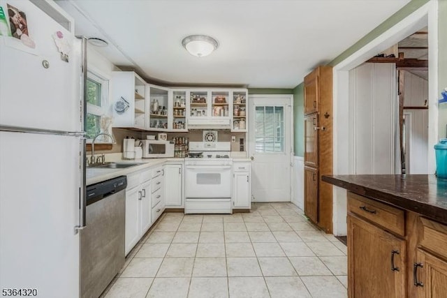 53 Lonaconing Rd, Vernon Twp, NJ 07422 - kitchen featuring white appliances, open shelves, under cabinet range hood, light tile patterned floors, and dark countertops
