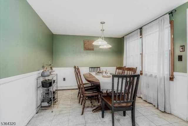 53 Lonaconing Rd, Vernon Twp, NJ 07422 - dining space featuring a baseboard radiator, a wainscoted wall, and light tile patterned flooring