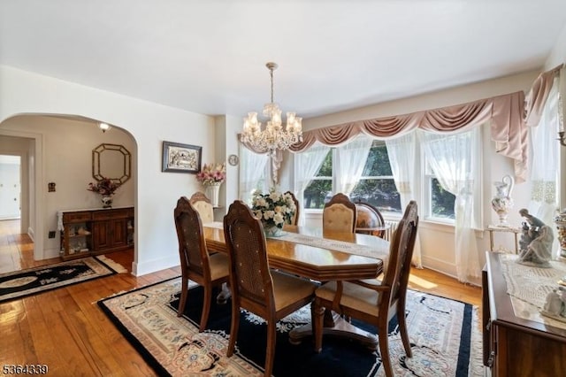 87 S Ridgedale Ave, East Hanover Twp, NJ 07936 - dining space featuring arched walkways, a chandelier, and light wood-type flooring