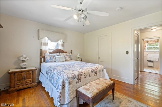 87 S Ridgedale Ave, East Hanover Twp, NJ 07936 - bedroom featuring multiple windows, radiator heating unit, and hardwood / wood-style floors