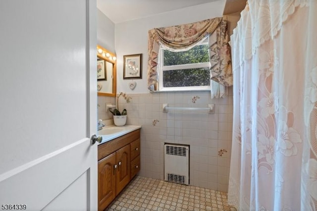 87 S Ridgedale Ave, East Hanover Twp, NJ 07936 - bathroom with radiator heating unit, vanity, tile walls, a shower with shower curtain, and a wainscoted wall