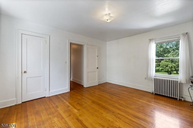 87 S Ridgedale Ave, East Hanover Twp, NJ 07936 - unfurnished bedroom featuring radiator and wood-type flooring