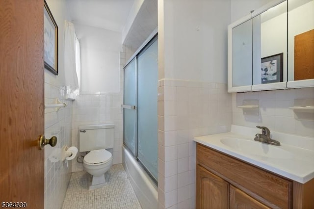 87 S Ridgedale Ave, East Hanover Twp, NJ 07936 - full bath featuring tile walls, vanity, tile patterned flooring, shower / bath combination with glass door, and wainscoting