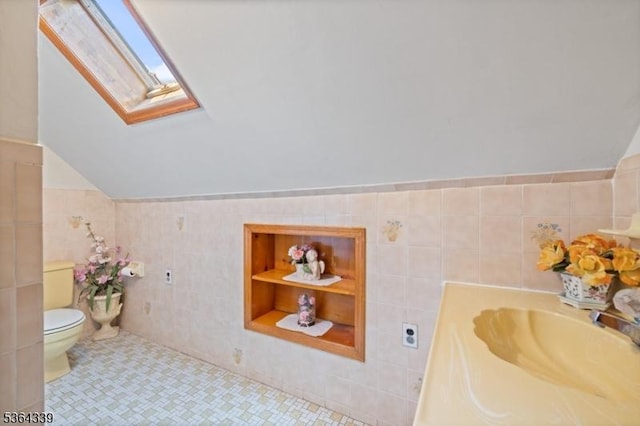 87 S Ridgedale Ave, East Hanover Twp, NJ 07936 - bathroom with a skylight, tile walls, vaulted ceiling, and vanity