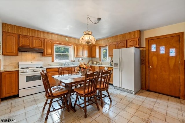 87 S Ridgedale Ave, East Hanover Twp, NJ 07936 - kitchen featuring white appliances, under cabinet range hood, light countertops, and plenty of natural light