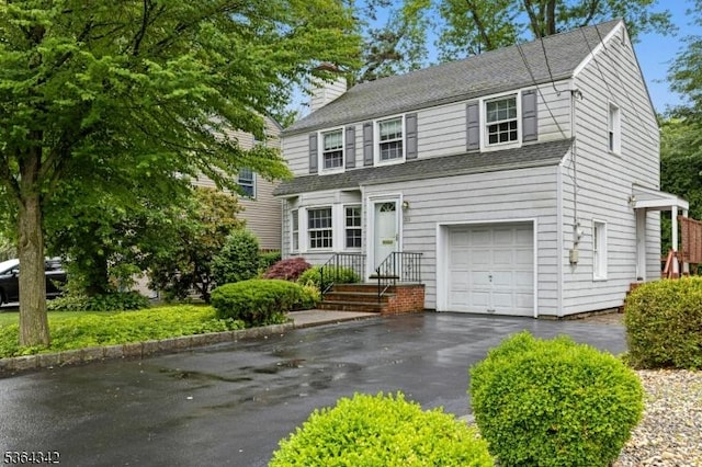 203 Beech St, Cranford Twp, NJ 07016 - traditional-style home with a chimney, a garage, roof with shingles, and driveway