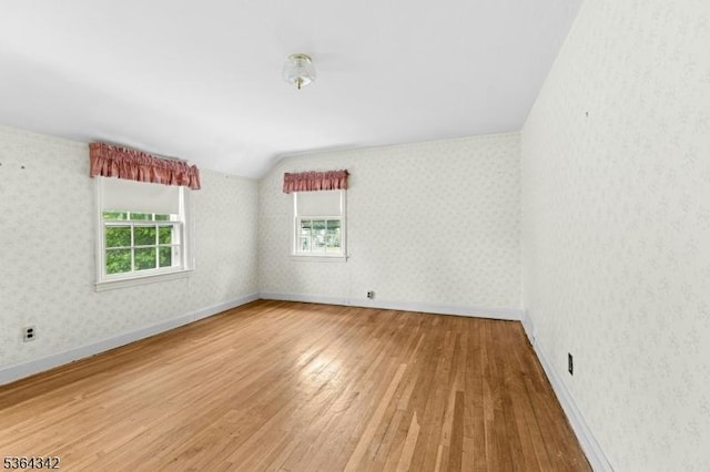203 Beech St, Cranford Twp, NJ 07016 - unfurnished room featuring hardwood / wood-style floors, vaulted ceiling, and wallpapered walls
