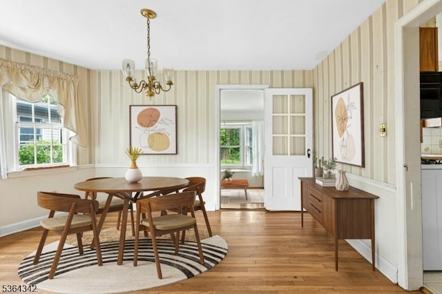 203 Beech St, Cranford Twp, NJ 07016 - dining room featuring wallpapered walls, plenty of natural light, wood finished floors, and a chandelier