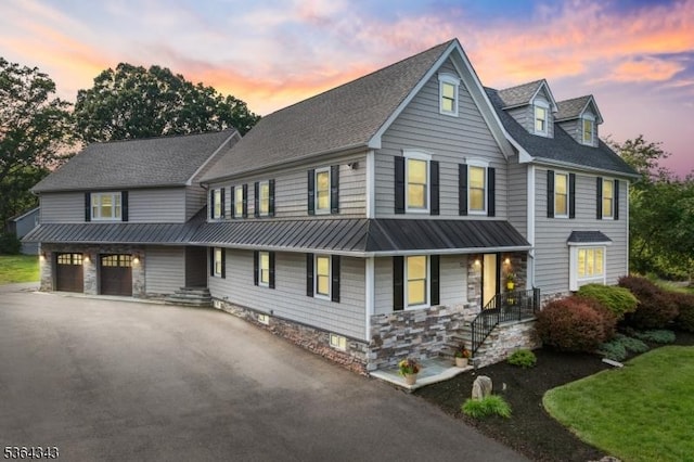 231 Woods Rd, Hillsborough Twp, NJ 08844 - multi unit property featuring a standing seam roof, driveway, covered porch, a metal roof, and a garage