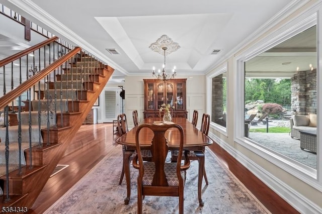 231 Woods Rd, Hillsborough Twp, NJ 08844 - dining room featuring a chandelier, stairs, dark wood-style floors, ornamental molding, and a tray ceiling