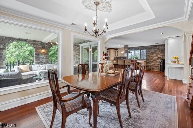 231 Woods Rd, Hillsborough Twp, NJ 08844 - dining room with hardwood / wood-style flooring, a chandelier, and arched walkways