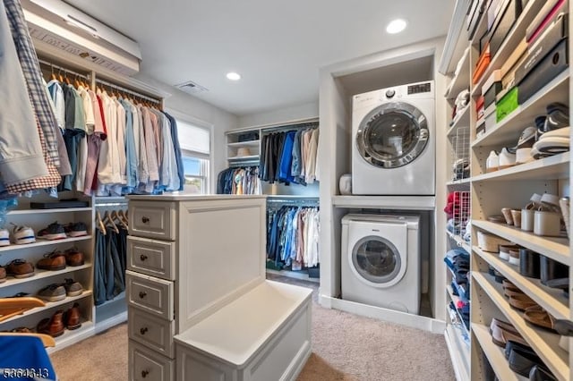 231 Woods Rd, Hillsborough Twp, NJ 08844 - walk in closet featuring stacked washer / dryer and carpet