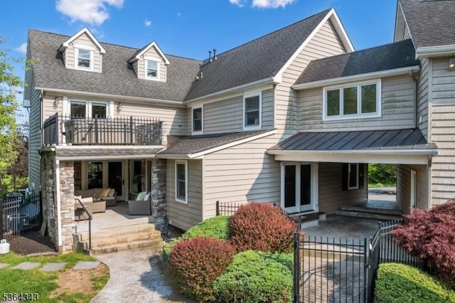 231 Woods Rd, Hillsborough Twp, NJ 08844 - view of front facade featuring an outdoor hangout area, a balcony, a patio area, a standing seam roof, and a shingled roof