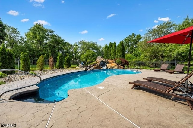 231 Woods Rd, Hillsborough Twp, NJ 08844 - view of swimming pool featuring a patio area and view of wooded area