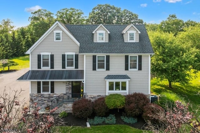 231 Woods Rd, Hillsborough Twp, NJ 08844 - view of front of house with a standing seam roof, a metal roof, stone siding, and roof with shingles