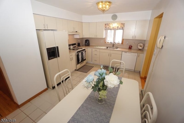 44 Joseph St, Clark Twp, NJ 07066 - kitchen featuring white appliances, light countertops, and under cabinet range hood