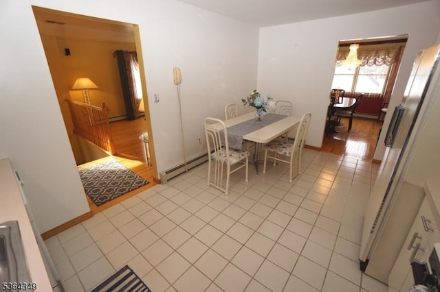 44 Joseph St, Clark Twp, NJ 07066 - dining area with light tile patterned floors and a baseboard radiator