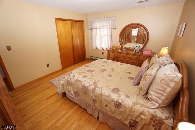 44 Joseph St, Clark Twp, NJ 07066 - bedroom featuring light wood-style flooring, a closet, and a baseboard heating unit