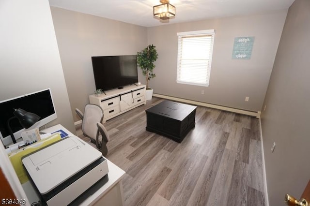 44 Joseph St, Clark Twp, NJ 07066 - living area with light wood-type flooring and baseboard heating