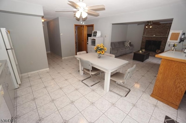 44 Joseph St, Clark Twp, NJ 07066 - dining space featuring ceiling fan and a brick fireplace