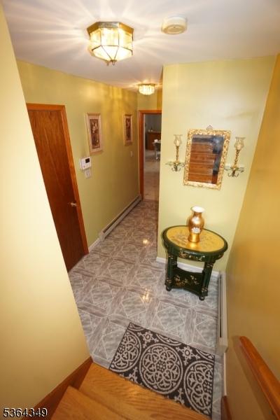 44 Joseph St, Clark Twp, NJ 07066 - corridor with a baseboard radiator