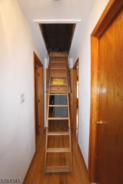 44 Joseph St, Clark Twp, NJ 07066 - stairway featuring wood finished floors