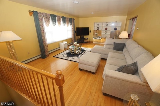 44 Joseph St, Clark Twp, NJ 07066 - living area with light wood finished floors, a baseboard radiator, and baseboard heating