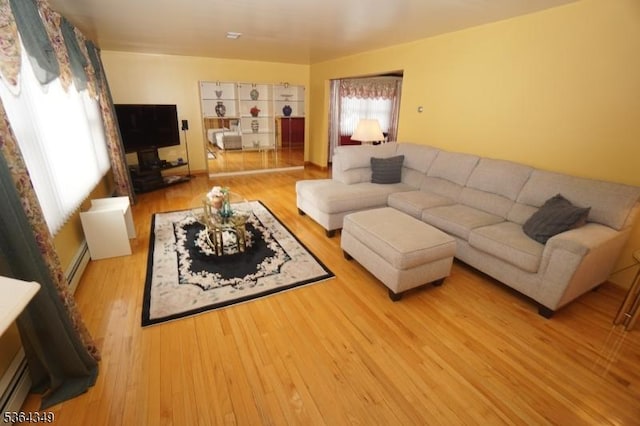 44 Joseph St, Clark Twp, NJ 07066 - living room featuring baseboard heating and wood finished floors