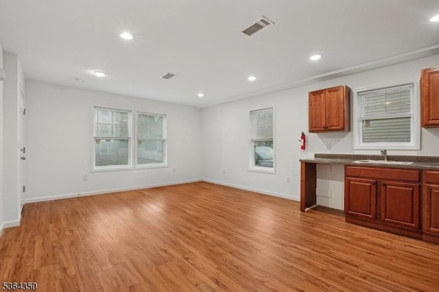 87-A N 18th St, East Orange City, NJ 07017 - kitchen with light wood-type flooring, recessed lighting, open floor plan, and dark countertops