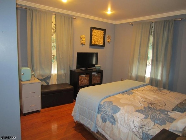 7 Brunswick Ave, Union Twp, NJ 07088 - bedroom featuring crown molding and wood finished floors