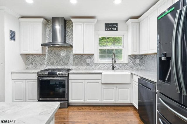 1126-1200 Grant Ave, Plainfield City, NJ 07060 - kitchen featuring stainless steel appliances, wall chimney range hood, white cabinets, and recessed lighting