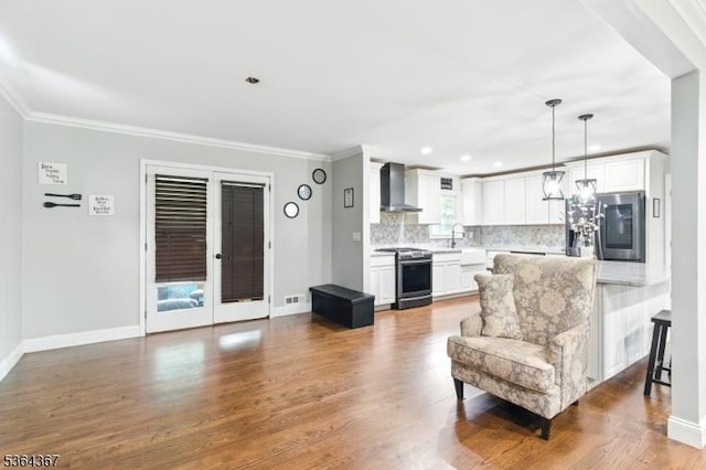 1126-1200 Grant Ave, Plainfield City, NJ 07060 - living area featuring dark wood finished floors, ornamental molding, and recessed lighting