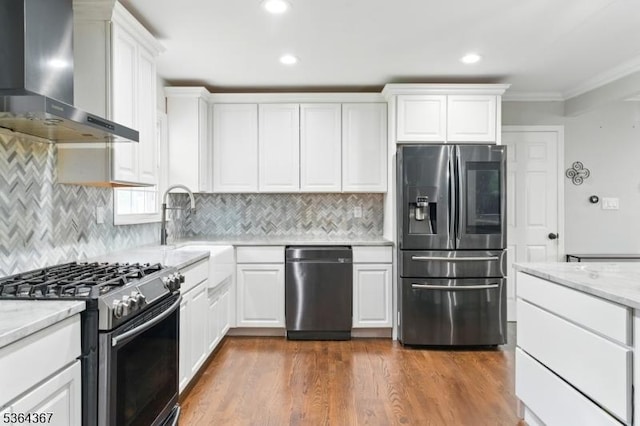 1126-1200 Grant Ave, Plainfield City, NJ 07060 - kitchen featuring wall chimney range hood, stainless steel appliances, recessed lighting, ornamental molding, and white cabinetry