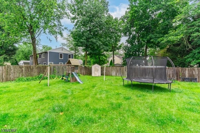 1126-1200 Grant Ave, Plainfield City, NJ 07060 - fenced backyard with a storage unit, a trampoline, and a playground
