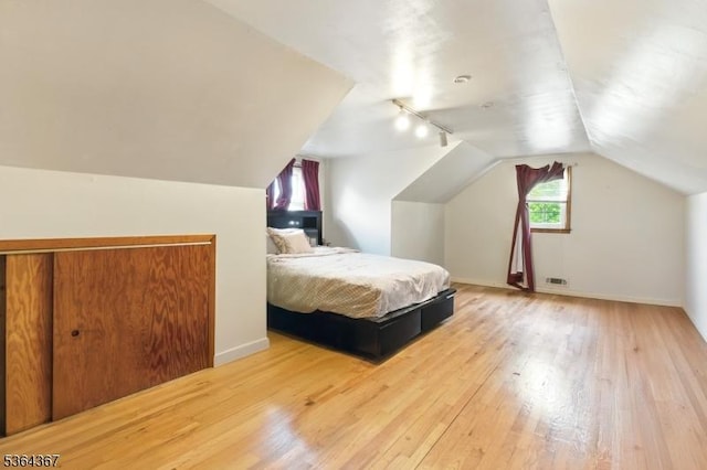 1126-1200 Grant Ave, Plainfield City, NJ 07060 - bedroom with hardwood / wood-style floors, track lighting, and vaulted ceiling