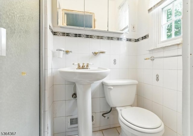 1126-1200 Grant Ave, Plainfield City, NJ 07060 - bathroom featuring tile walls, an enclosed shower, and tile patterned floors